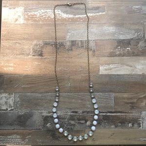 Long white necklace with gold chain
